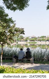 KAIFENG, CHINA, JUNE 5, 2021: Lake View Bench Of Long Ting Park