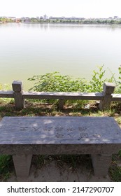 KAIFENG, CHINA, JUNE 5, 2021: Lake View Bench Of Long Ting Park