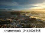 Kaikoura Coastline Landscape at Dawn when the sun lights up the rocks and waves, New Zealand.