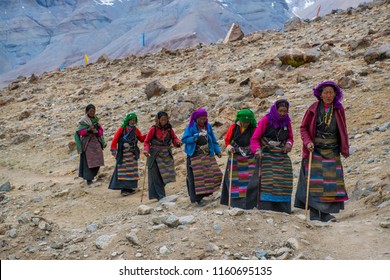 Kailash area, Tibet / China - Aug 2017: The tibetans pilgrims during the second day of ritual kora (yatra) around sacred Mount Kailash. Ngari scenery in West Tibet. Sacred place for Buddha pupils. 