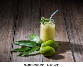 Kairi panha OR Panna OR Raw Mango Drink is a traditional and most popular Indian summer beverage served in a glass over colourful or wooden background. Selective focus