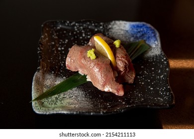 Kaiseki sushi platter combo set on the serving board in the fine dining Japanese restaurant, sashimi, nigiri and raw fish - Shutterstock ID 2154211113