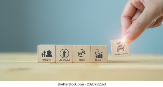Kaizen concept; the continuous improvement in business for efficiency and effectiveness. Kaizen cycle icon on wood cubes; improve, continuous, process, result, standard solution. Quality improvement.  - Shutterstock ID 2020951163