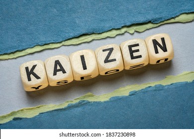 Kaizen Word Abstract In Wooden Letter Cubes Against Paper Abstract In Green Tones,  Japanese Continuous Improvement And A Change For Better Concept