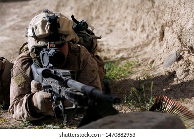 Kajaki, Afghanistan - April 22, 2012: US Marine Watches Over His Field Of Fire While On Patrol.