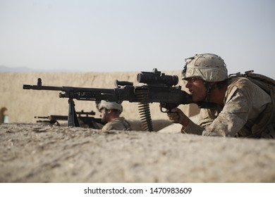 Kajaki, Afghanistan - July 18, 2012: US Marine Looks Through His Optic Attached To His M240B Machine Gun.