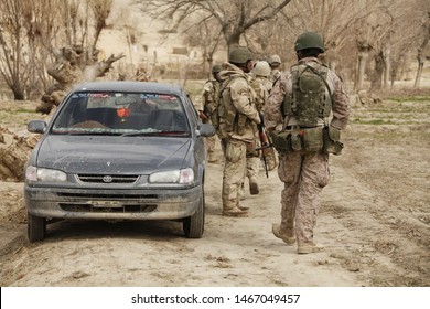 Kajaki, Afghanistan - March 01, 2012: Afghan Military And US Marines Patrol Their Battle Space.