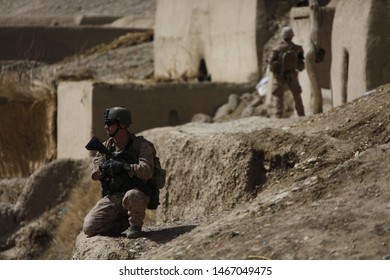 Kajaki, Afghanistan - March 01, 2012: Afghan Military And US Marines Patrol Their Battle Space.