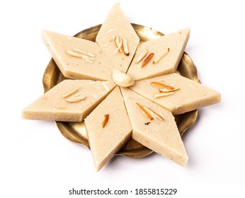 Kaju katli / kaju barfi is a diamond shape indian sweet made with using cashew stock image. 