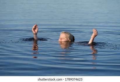 Kakerdaja / Estonia - August 01 2020: Teenager Blonde Girl Swimming In Bog Lake. Hands And Feet Spread Out. Human Body Floating In Pool. 