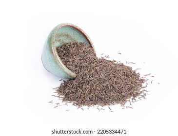 Kala Jeera or Black Cumin Spilling from Green Pottery Bowl or Dish Isolated on White in Side View Point of View Shot - Shutterstock ID 2205334471