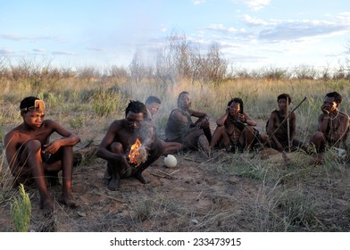 KALAHARI, BOTSWANA - DECEMBER 31, 2008: Bushmen in the desert making fire