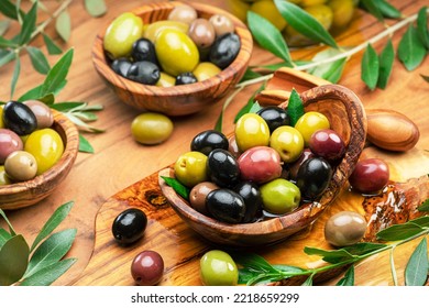 Kalamata, Green And Black Olives In The Wooden Bowls. Food Background. Top View.