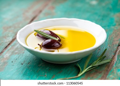 Kalamata olives in a bowl of olive oil - Powered by Shutterstock