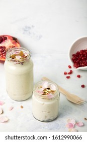 Kalamro - A Dessert Made With Curd And Rice And Topped With Dry Fruits, Pomegranate, Rose Petals And Fennel Seed Powder And Served Cold.