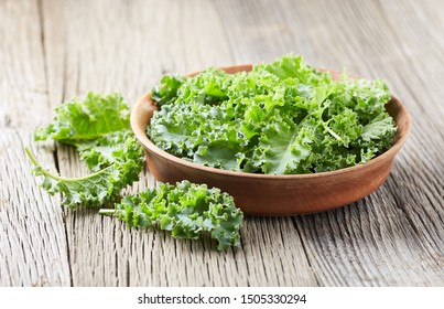Kale cabbage on wooden background