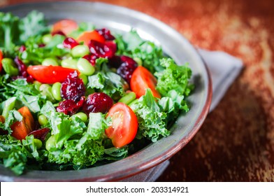 Kale And Edamame Salad On Rustic Background