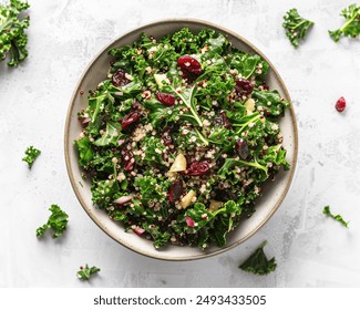 Kale and Quinoa Salad, Massaged kale mixed with cooked quinoa, dried cranberries, and a lemon-tahini dressing. - Powered by Shutterstock