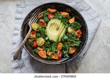 Kale, Roasted Yams And Avocado Salad On Stone Background