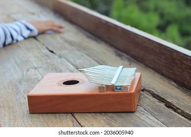 Kalimba, Acoustic Music Instrument From Africa And At Wood Desk Near Pancar Mountain, West Java Indonesia