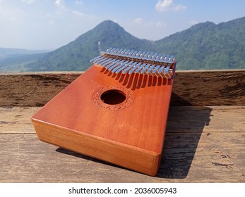 Kalimba, Acoustic Music Instrument From Africa And At Wood Desk Near Pancar Mountain, West Java Indonesia