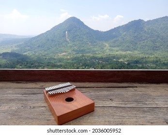 Kalimba, Acoustic Music Instrument From Africa And At Wood Desk Near Pancar Mountain, West Java Indonesia