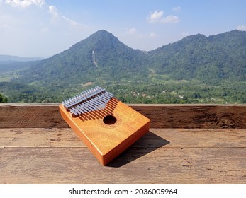 Kalimba, Acoustic Music Instrument From Africa And At Wood Desk Near Pancar Mountain, West Java Indonesia