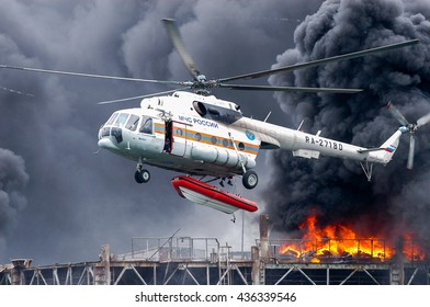 Kaliningrad, Russia - April 23, 2004:Helicopter Extinguishes The Fire On Oil Platform In The Baltic Sea