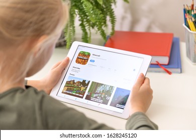 Kaliningrad / Russia - January 5 2020:  Minecraft game application is open on the Apple iPad Air of a little girl in the App store. Minecraft is a very popular game among children and adolescents.