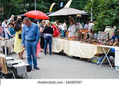 KALININGRAD, RUSSIA - JULY 14: Street trade in goods of folk art at celebration day of the city on july 14, 2013 in Kaliningrad, Russia. 