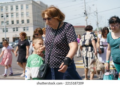 Kaliningrad, Russia - June 19, 2022: Townscape At The Sunny Summer Day. People Crossing The Street. Overhead Pedestrian Crosswalk.  Lifestyle Concept.