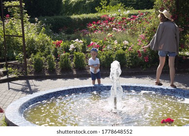 Kaliningrad, RussiaJuly 18,2020:
Little Boy  Standing Straight And Thinking Deep Thoughts Roses Garden