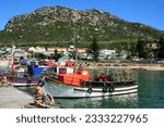 Kalk Baai (Bay) harbor with colorful fishing boats anchored in the save harbor