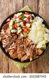 Kalua Pork The Famous Luau Style Pork Made Easy In The Slow Cooked Served With Stewed Cabbage And Fresh Salad Closeup In The Slate Plate On The Table. Vertical Top View From Above
