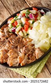 Kalua Pork The Famous Luau Style Pork Made Easy In The Slow Cooked Served With Stewed Cabbage And Fresh Salad Closeup In The Slate Plate On The Table. Vertical
