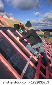 Kaluga, Russia October 28, 2019: Construction Work, Work With Waterproofing Material, Waterproofing Film For The Roof. New