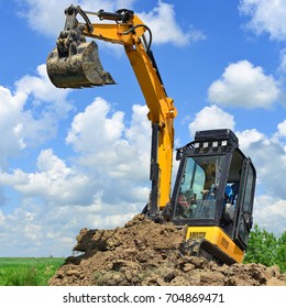 Kalush, Ukraine- June 15, 2017: The modern excavator JCB performs excavation work on the construction site near the city of Kalush, Western Ukraine.