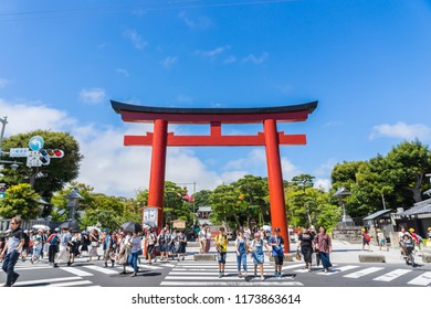 Kamakura, Japan - June 29, 2018: Tsurugaoka Hachimangu shrine and red torii under blue sky in Kamakura, Japan.