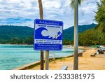 Kamala beach,Phuket,Thailand-May 11th 2024:Beachside sign  warning of the danger of a tsunami