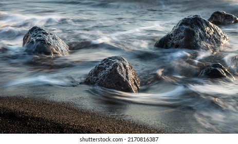 Kamari Greece Black Sand Beach And Ocean