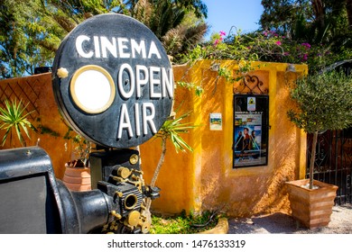 Kamari, Santorini / Greece: 18JUL2019:Santorini, Kamari Town Open Air Cinema. Main Entrance Of The Cinema Exterior.