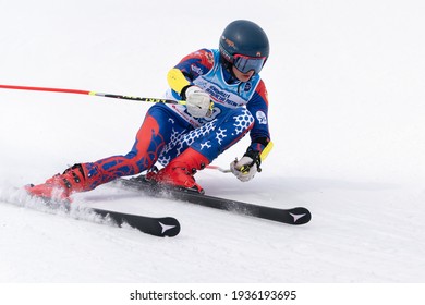 KAMCHATKA, RUSSIAN FEDERATION - APRIL 2, 2019: Russian Men's Alpine Skiing Championship - Giant Slalom. Mountain Skier Vadim Prikhodchenko Moscow Skiing Down Snowy Mountain Slope.