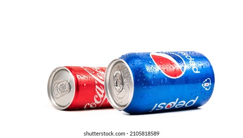 Kamenet - Podolsky, Ukraine - 12.01 2022: Footage Of Tin Can Or Metal Bottle Of Pepsi And Coca Cola Coke Light Taste On White Background With Droplets 