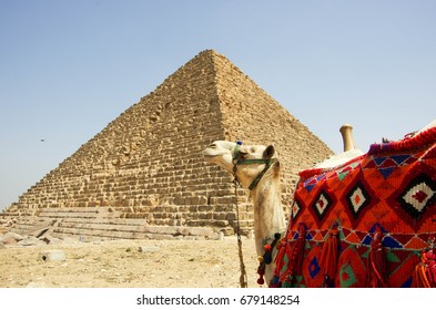 Kamila lies in front of the Egyptian pyramid. Tourist attraction. - Shutterstock ID 679148254