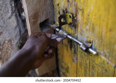 Kampala, Central, Uganda 2- 09- 2021
The African American Black Hand Opening Up The Old Door