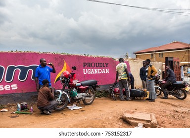 KAMPALA, UGANDA - CIRCA NOV, 2016: Daily Life In Kampala. Boda (motorbike Taxi) Riders Get Maintenance Services. 