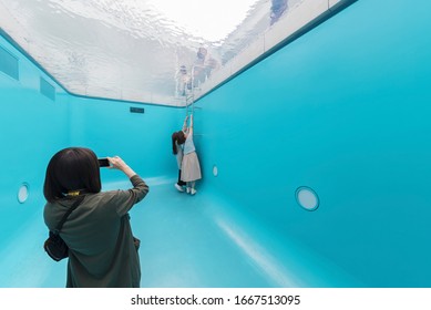 Kanazawa Japan - June 02, 2017 : Unidentified People Visit Optical Illusion Swimming Pool At 21st Century Museum In Kanazawa, Japan