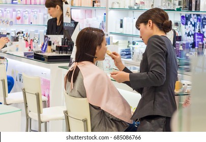 Kanazawa, Japan - March 30th, 2017: Japanese Beauty Experts Doing Make Up To Customers, Inside A Cosmetics Store In Kanazawa.