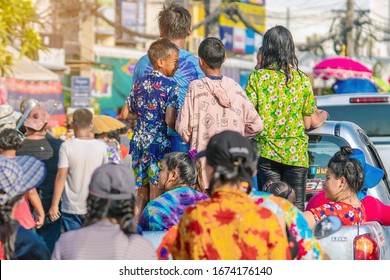 KANCHANABURI, THAILAND - APRIL 17,2019: Unidentified people celebrating Songkran by throwing water to each other on road on April 17, 2019 in Kanchanaburi, Thailand.