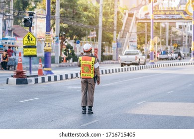 KANCHANABURI, THAILAND - APRIL 17,2019: Unidentified An employees of the traffic road police in uniforms serve on the city street on the road with transport on Songkran festival on April 17, 2019 